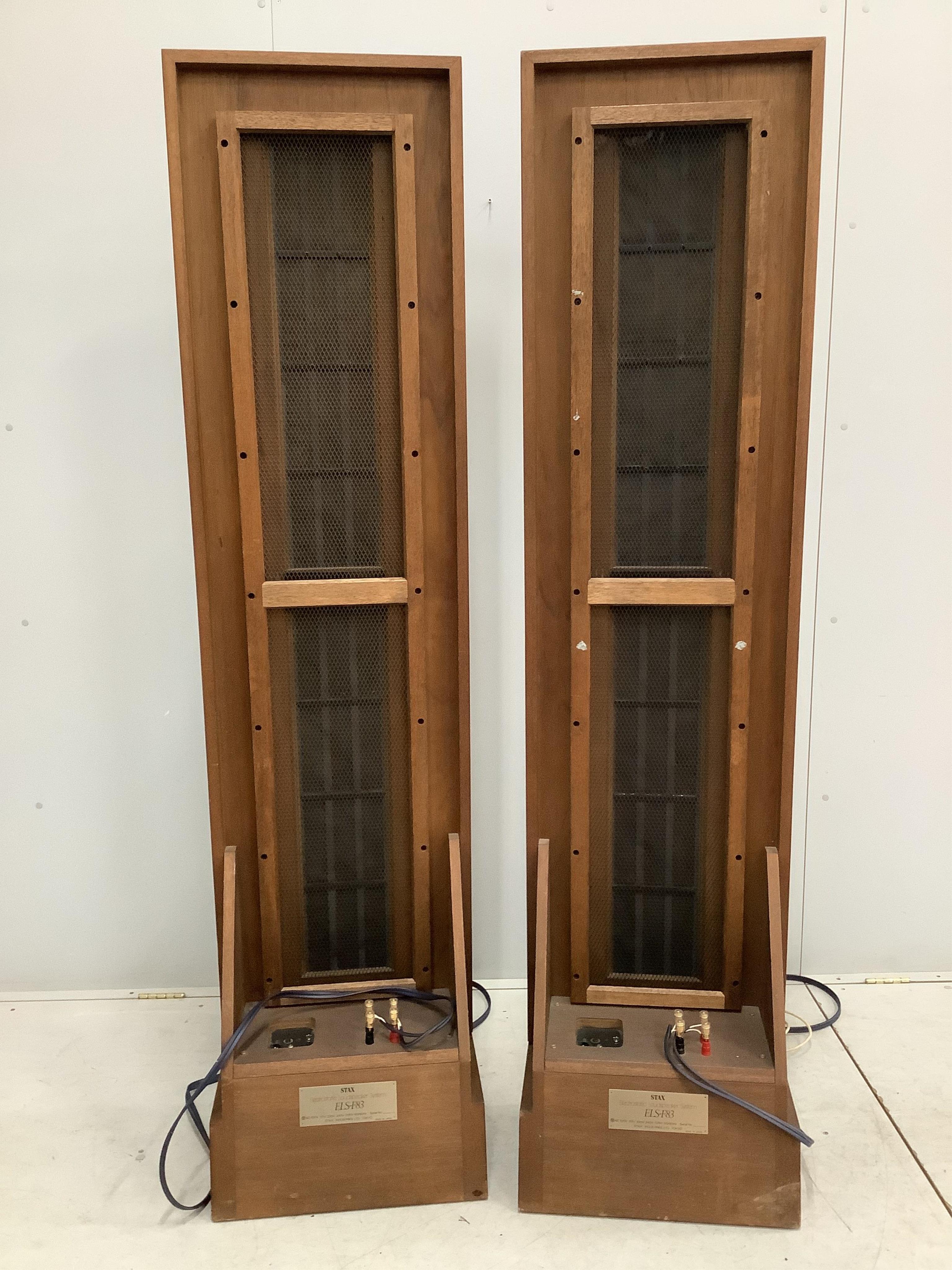 A large pair of floor standing Stax ELS-F83 Electrostatic Stereo speakers, 194cm high. Condition - fair, minor wear to fabric speaker covers, sold untested.